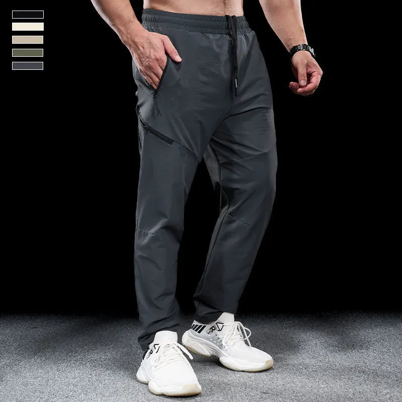 Men's waterproof quick-drying nylon workout trousers in Army Green colour showing mid waist design