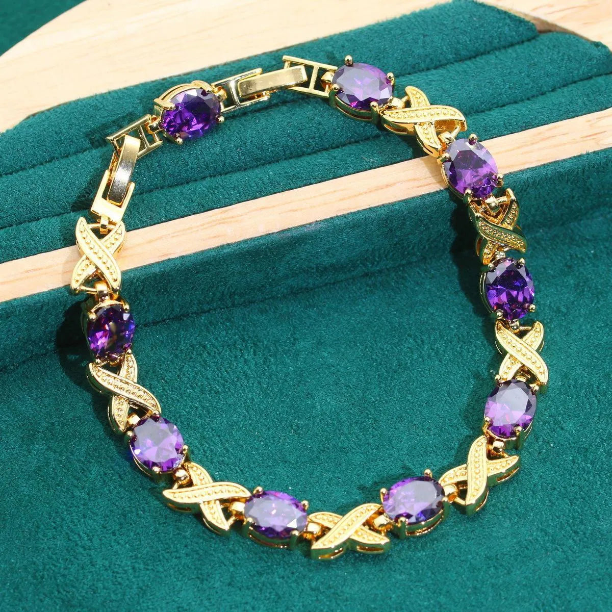 18k gold plated zircon jewellery set showing necklace, earrings, ring, and bracelet with synthetic cubic zirconia stones