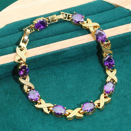 18k gold plated zircon jewellery set showing necklace, earrings, ring, and bracelet with synthetic cubic zirconia stones