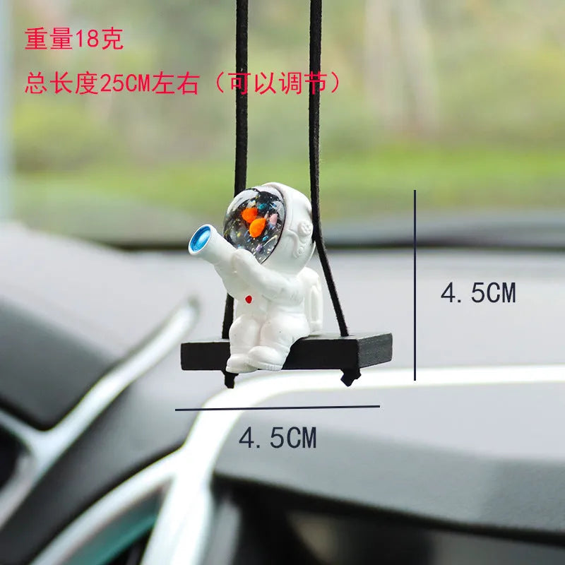 Resin cartoon astronaut car pendant showing designs like astronaut with telescope and astronaut holding a radish.