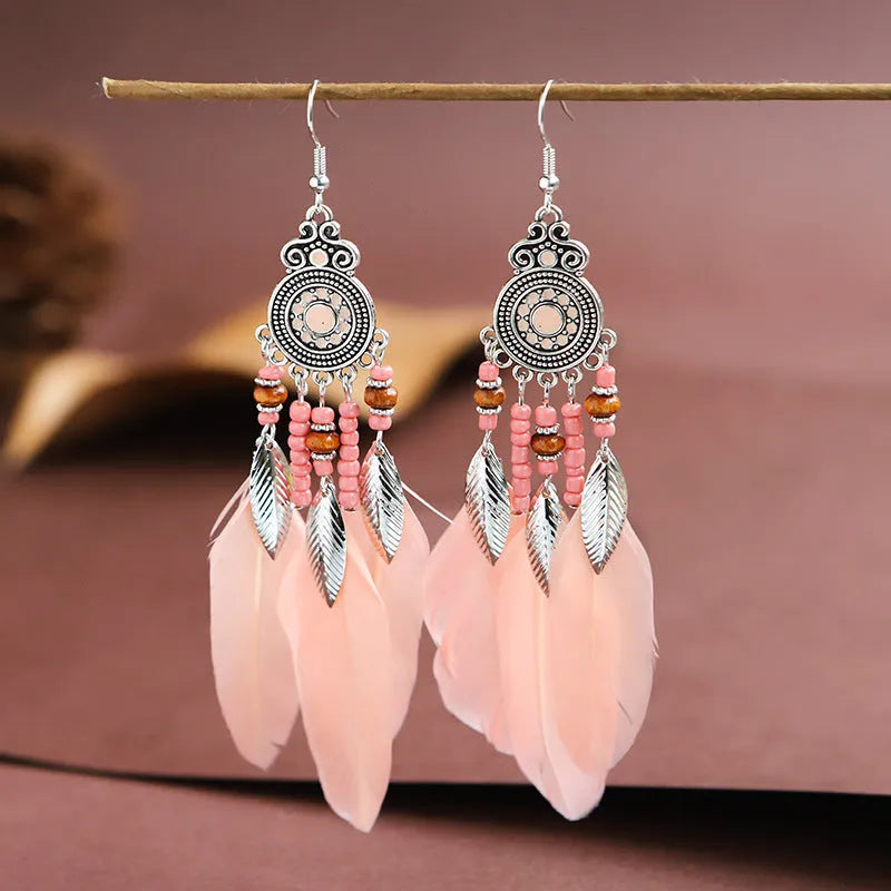 Round drop feather earrings with leaf detailing in various bohemian colours