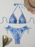 Women's denim blue printed bikini with adjustable straps, shown front view