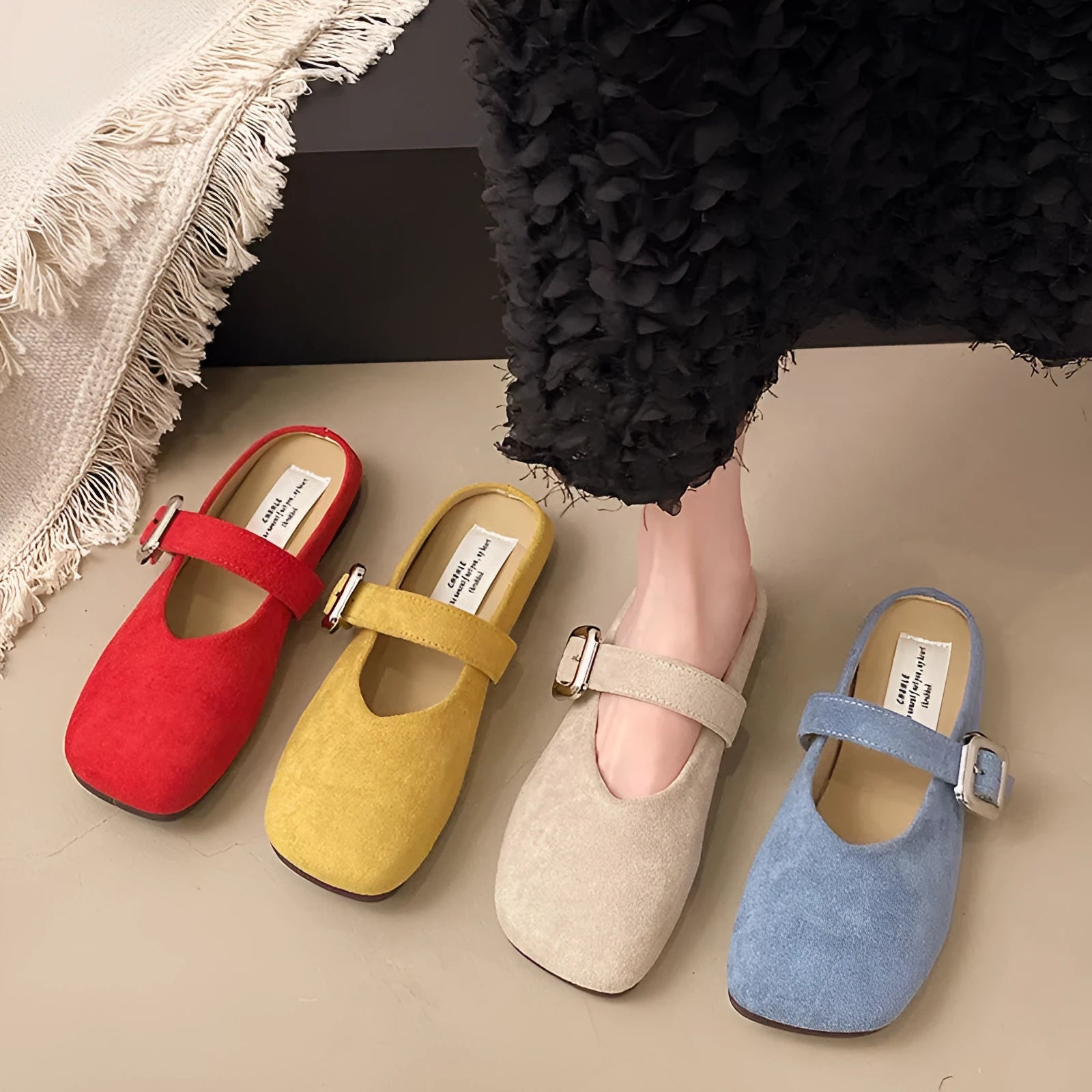 Women's flat closed toe slippers in apricot colour with a square toe and rubber sole.