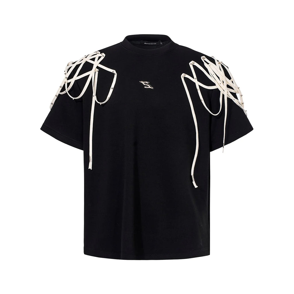 Black loose fit short sleeve T-shirt with ribbon and rivet decorated padded shoulders.