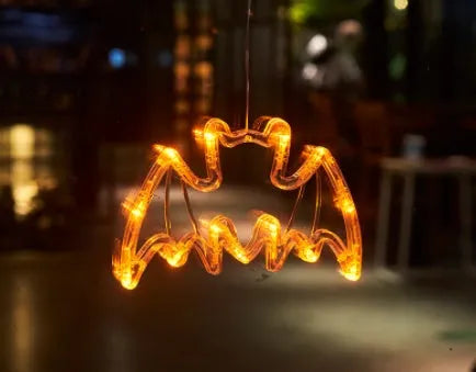 Halloween window hanging LED lights with suction cups showing multiple horror-themed designs powered by batteries