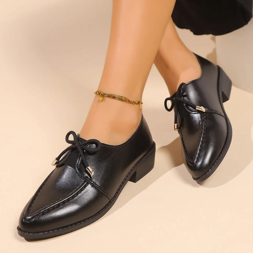 Women's British-style leather shoes with a decorative bow, rubber sole, and pointed toe.
