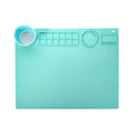 Green silicone painting mat measuring 50 by 40 centimetres with two round bowl wells for holding water or paint.