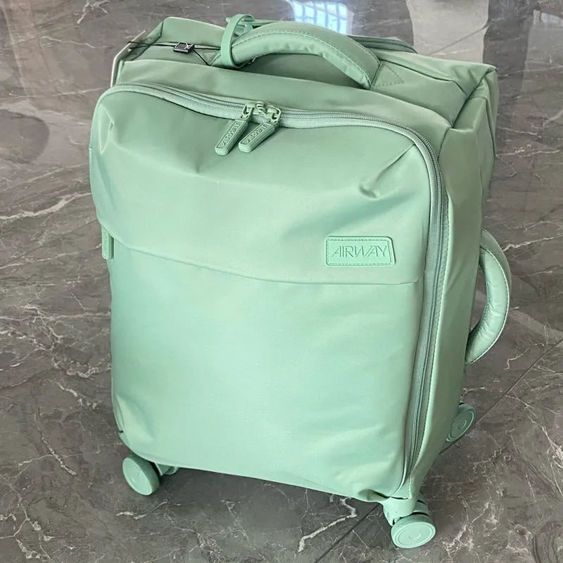Ultra-light waterproof Oxford cloth suitcase with universal wheels in bluestone green colour.