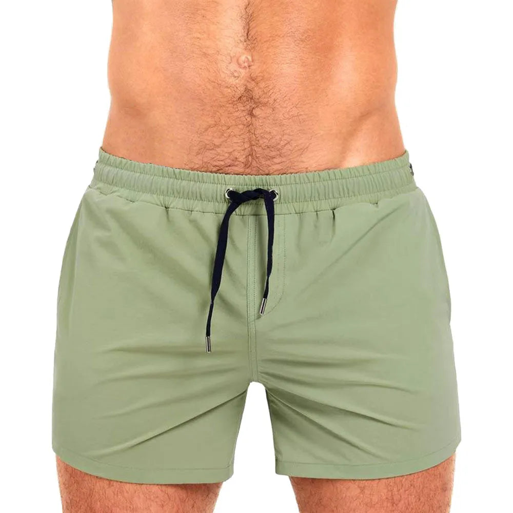 Mesh lining polyester sports shorts in solid colours for swimming and fitness.