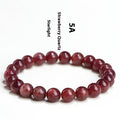 Natural strawberry quartz bracelet with geometric red crystal beads in three size options from 7mm to 10.8mm diameter