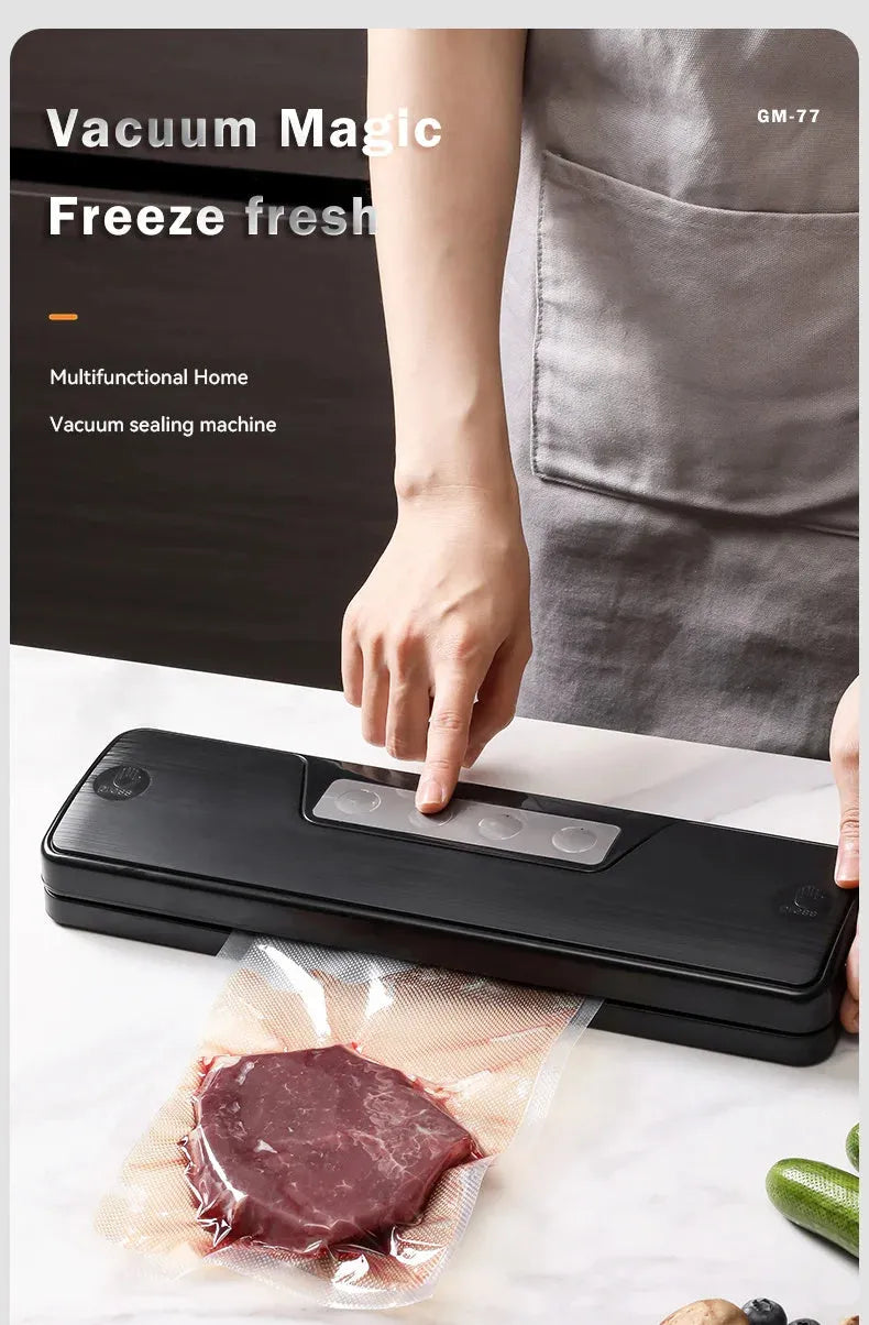 Small black automatic vacuum sealer machine on a kitchen countertop