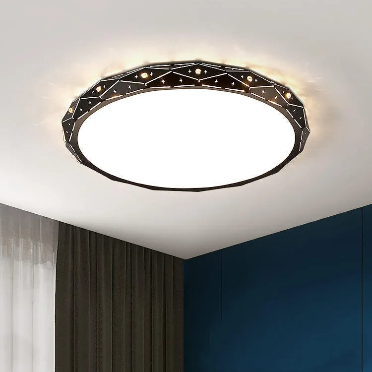 Round black and white framed LED ceiling light fixture for room installation.