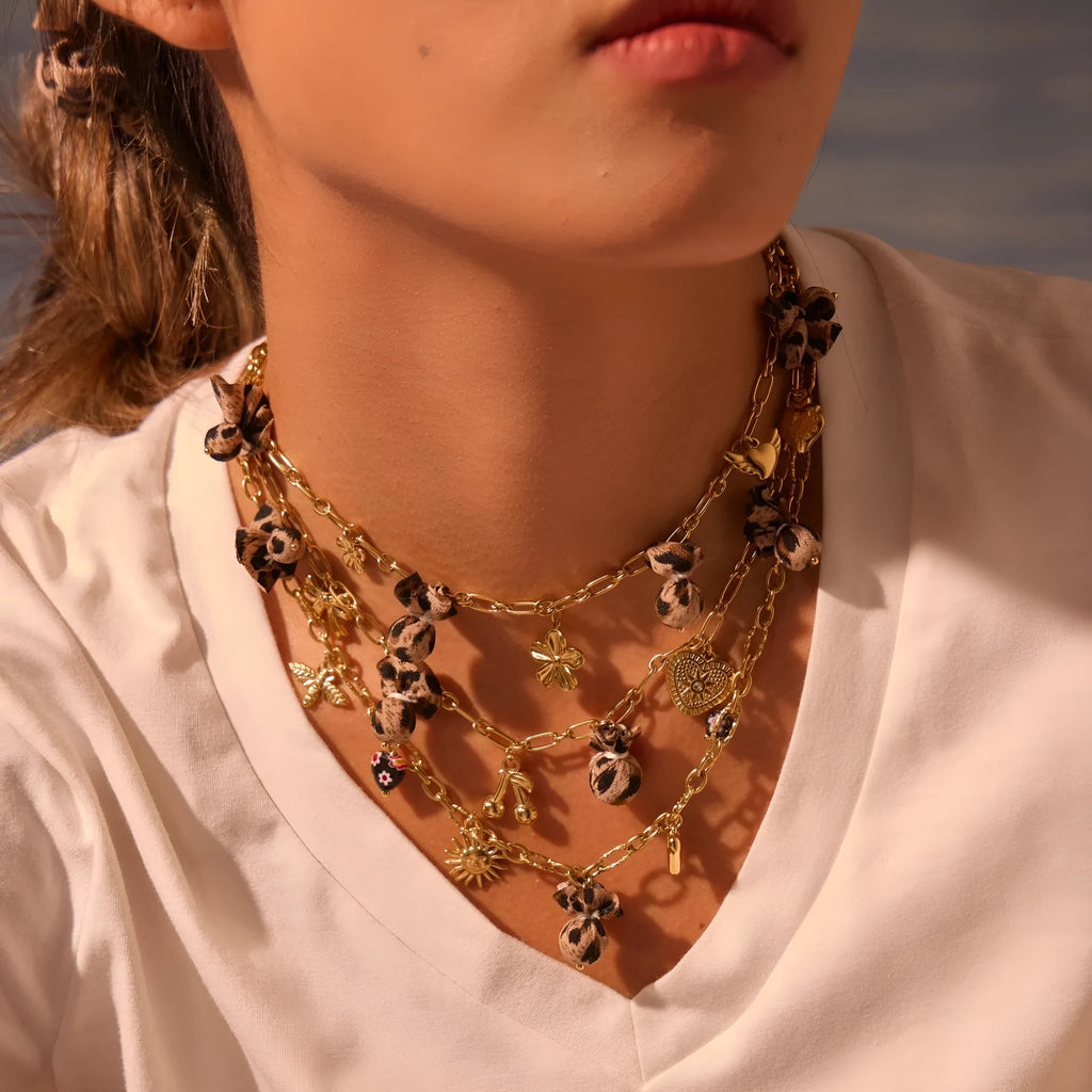 Leopard, love heart, and flowers design on a geometric stainless steel pendant necklace with an adjustable chain.