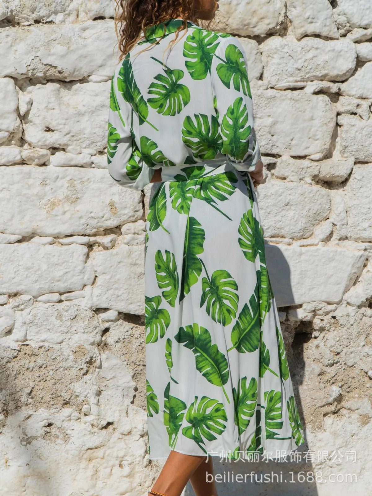 Women's V-neck chiffon dress with high waist and A-line skirt in a printed pattern.