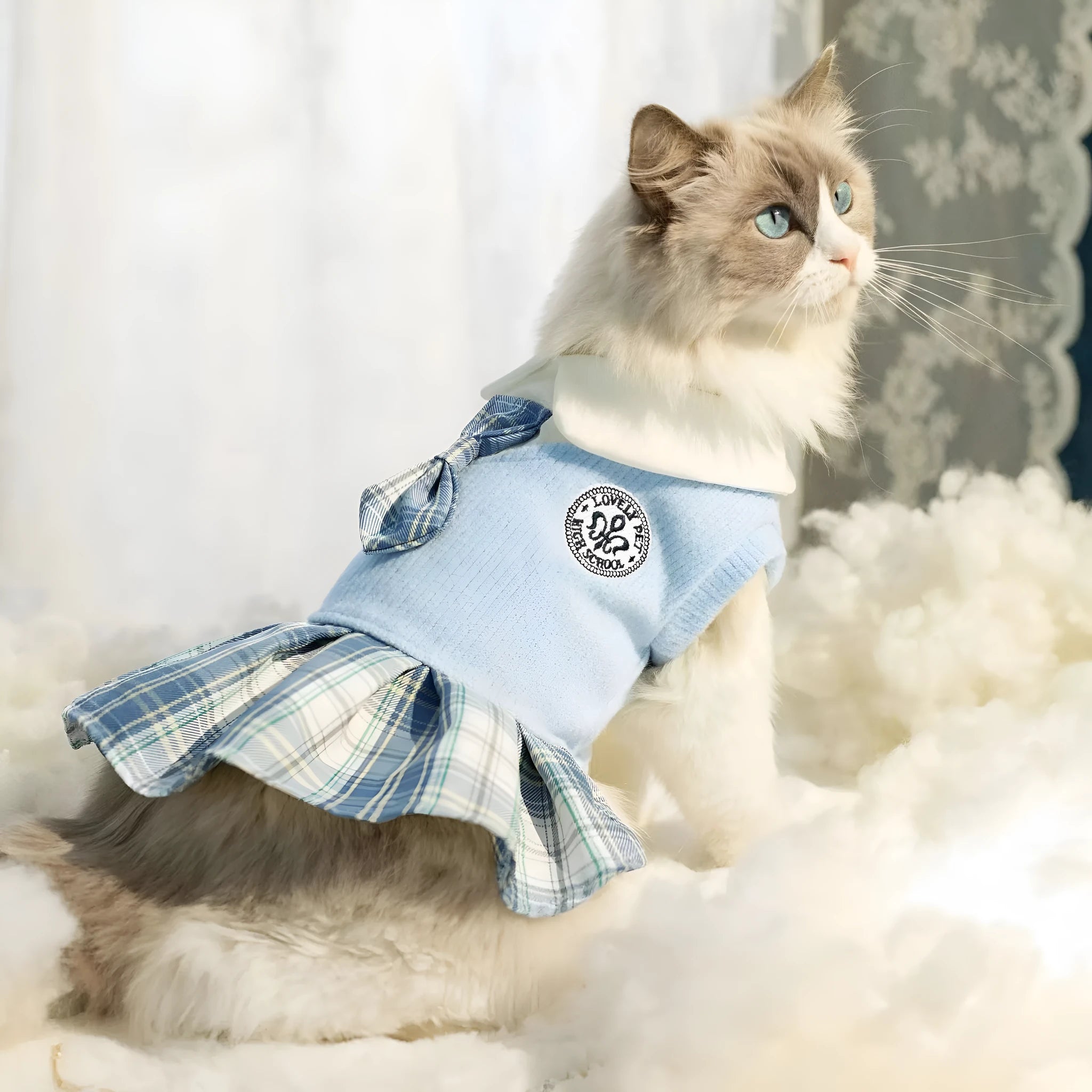 A pink tartan skirt for a small dog, showing the elastic waistband and princess-style flare.
