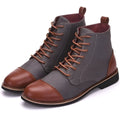 Men's black leather motorcycle-style boots with silver belt buckles on the side, featuring a thick rubber sole.