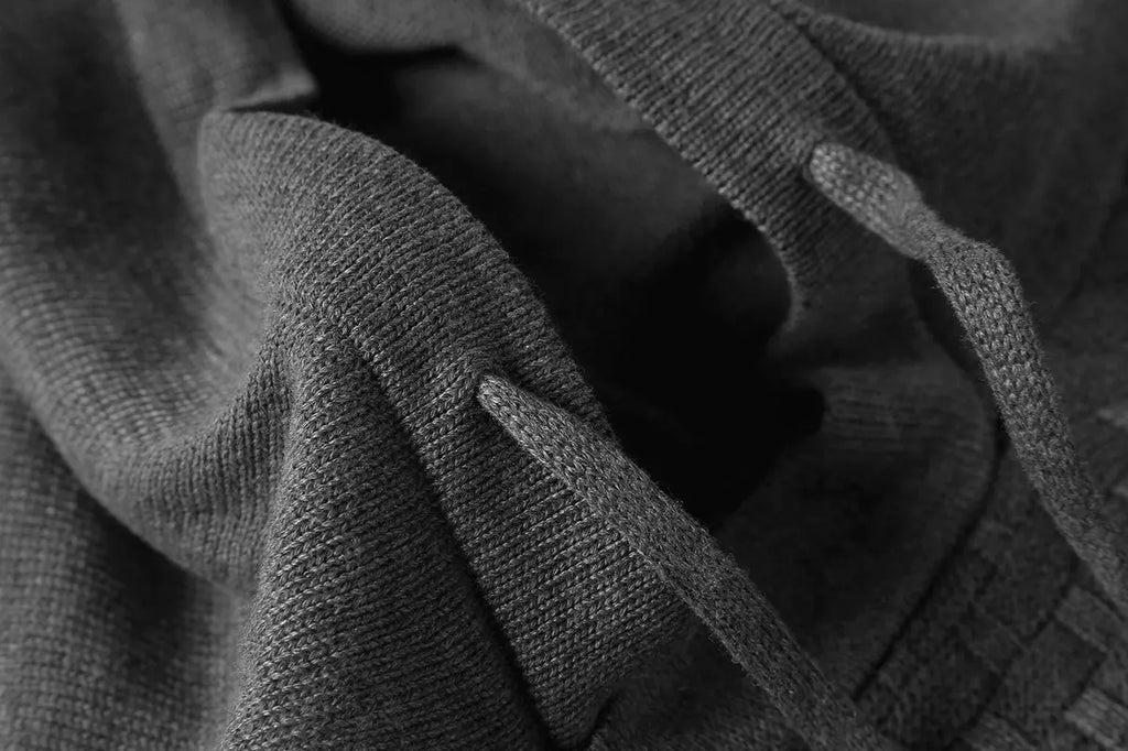 A man's plain hooded sweatshirt in a cotton-polyester blend, shown in multiple colour options.