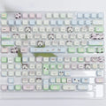 Colourful cat and puppy themed PBT key cap set for mechanical keyboards with cartoon animal artwork