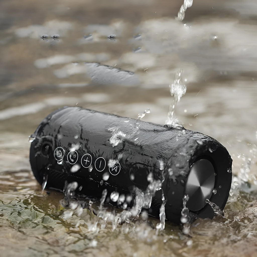 Waterproof outdoor Bluetooth speaker in red colour with control buttons and ports visible.
