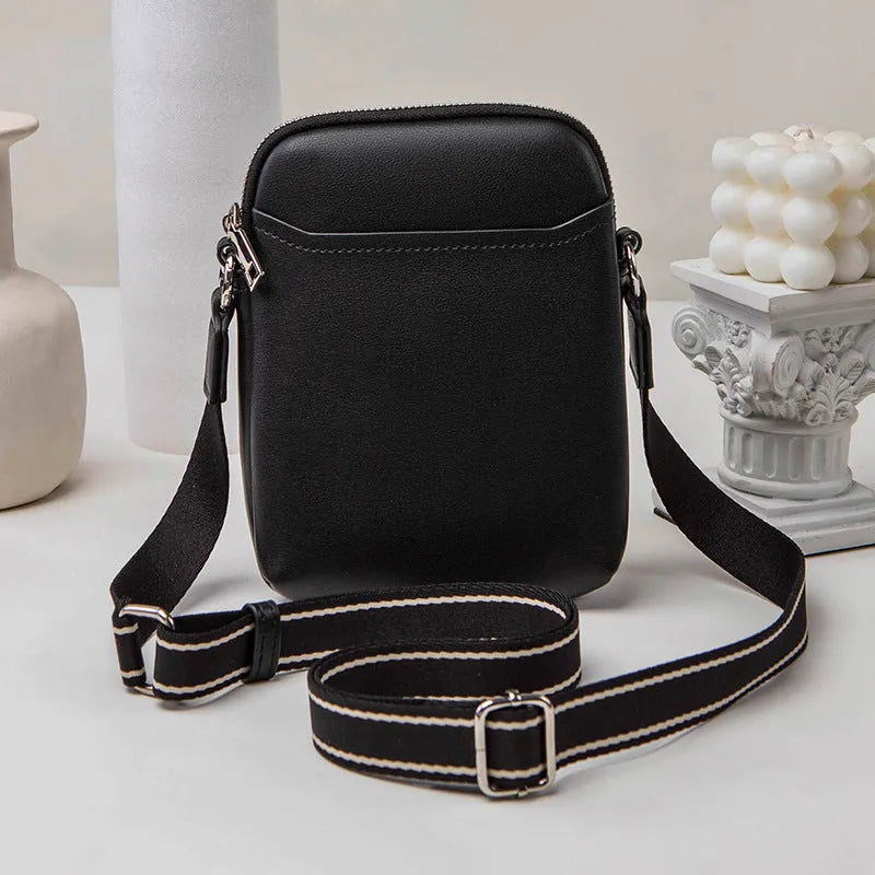 Small solid colour mobile phone crossbody bag in PU leather measuring 14.5cm wide
