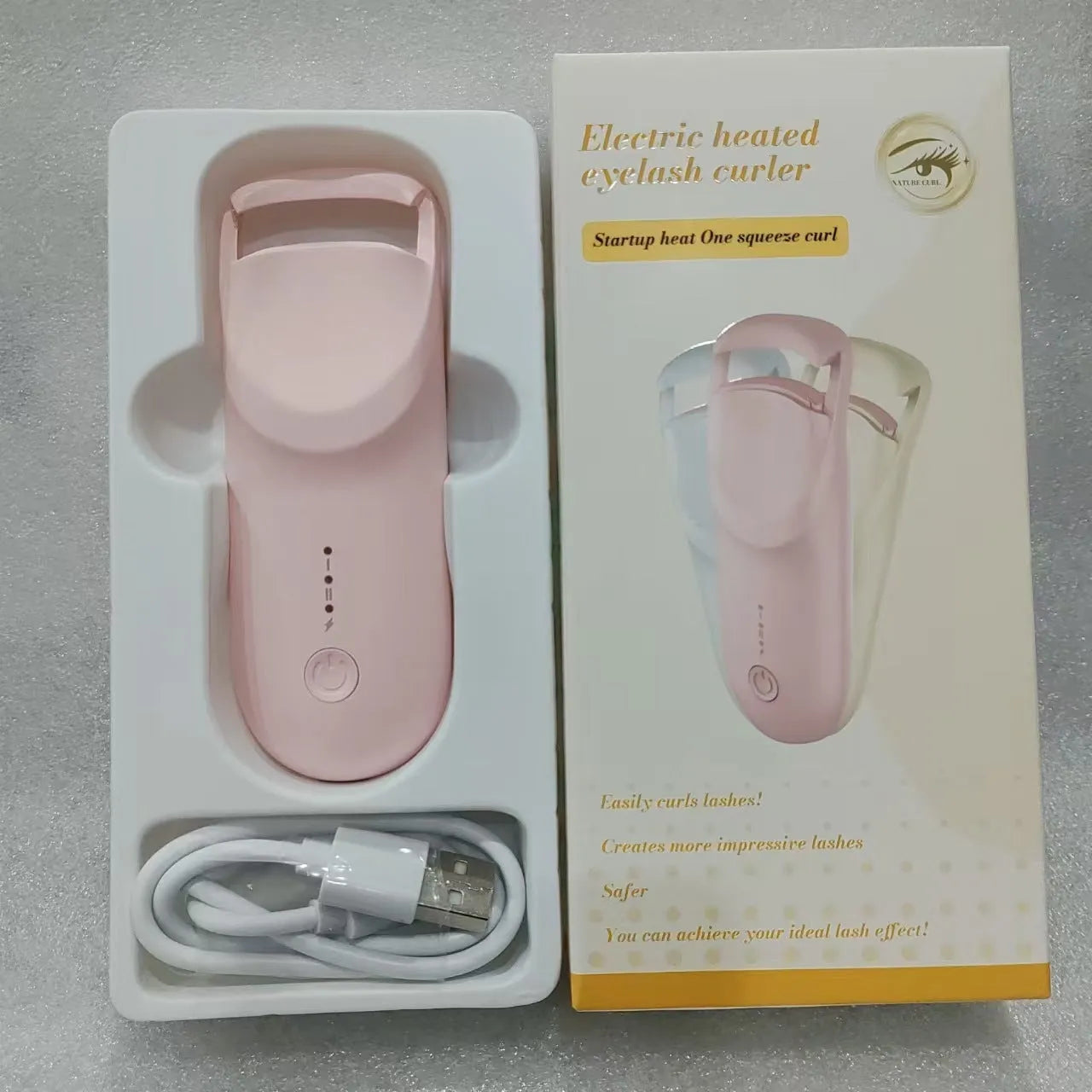 Plastic electric heating eyelash curler with USB cable in cream white colour
