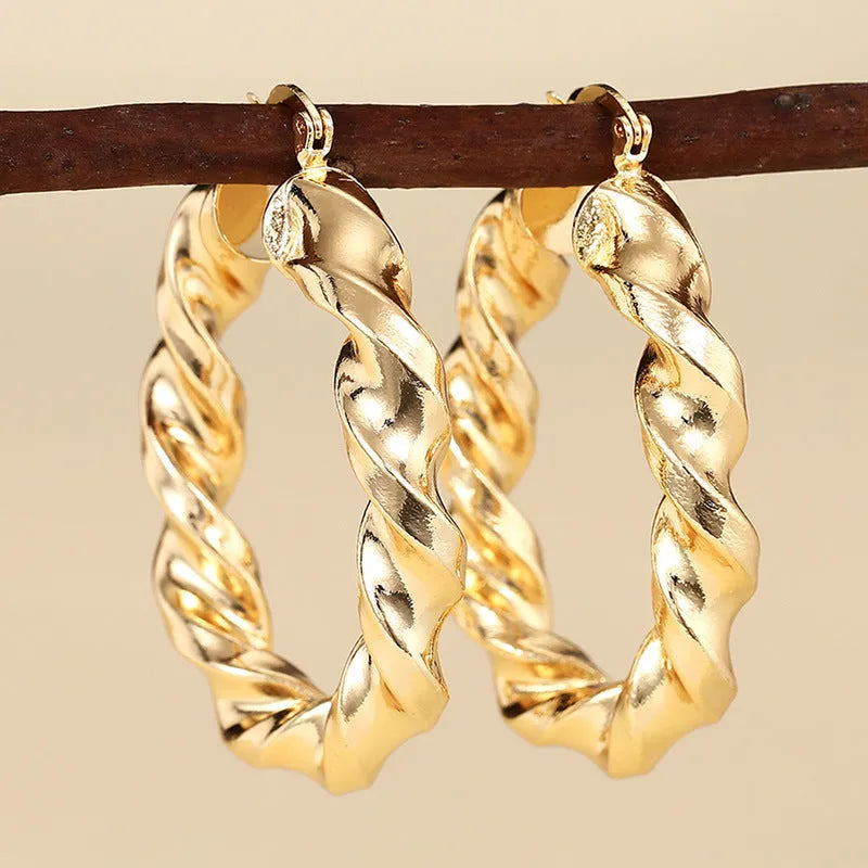 Women's geometric ring design ear clip earrings with drop-shaped elements and electroplated copper construction