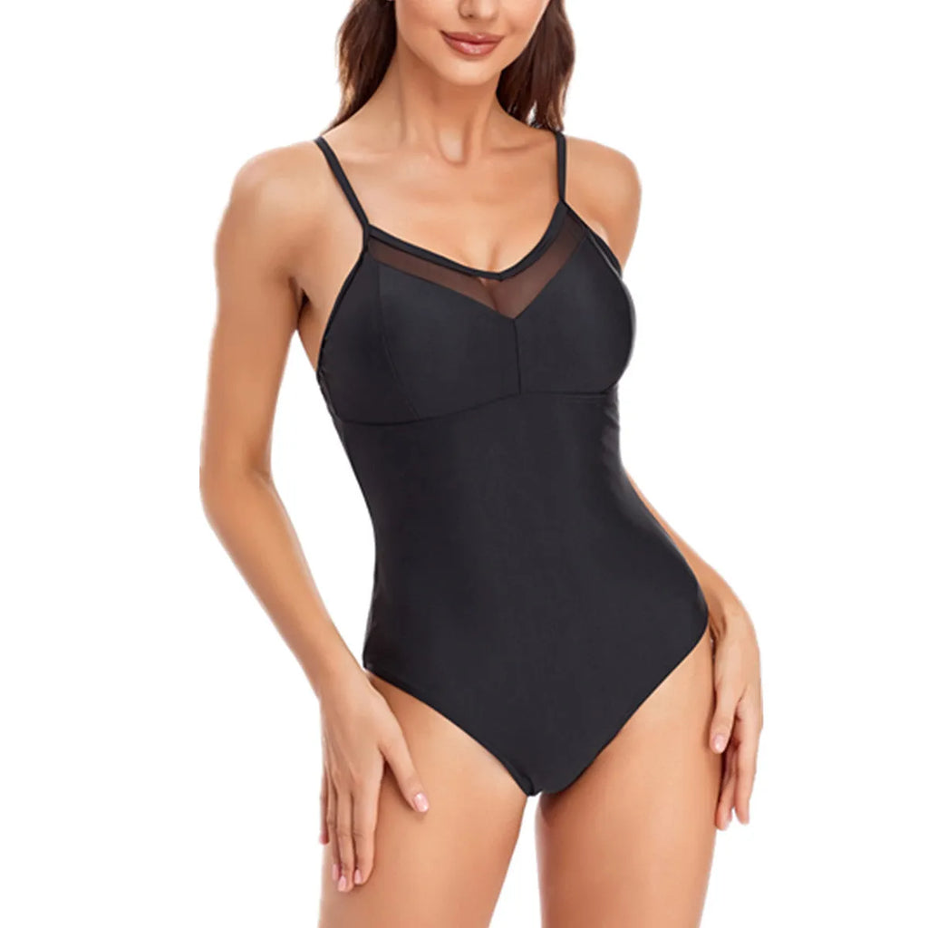 Black backless one-piece swimsuit with mesh panels for women, shown on a mannequin.
