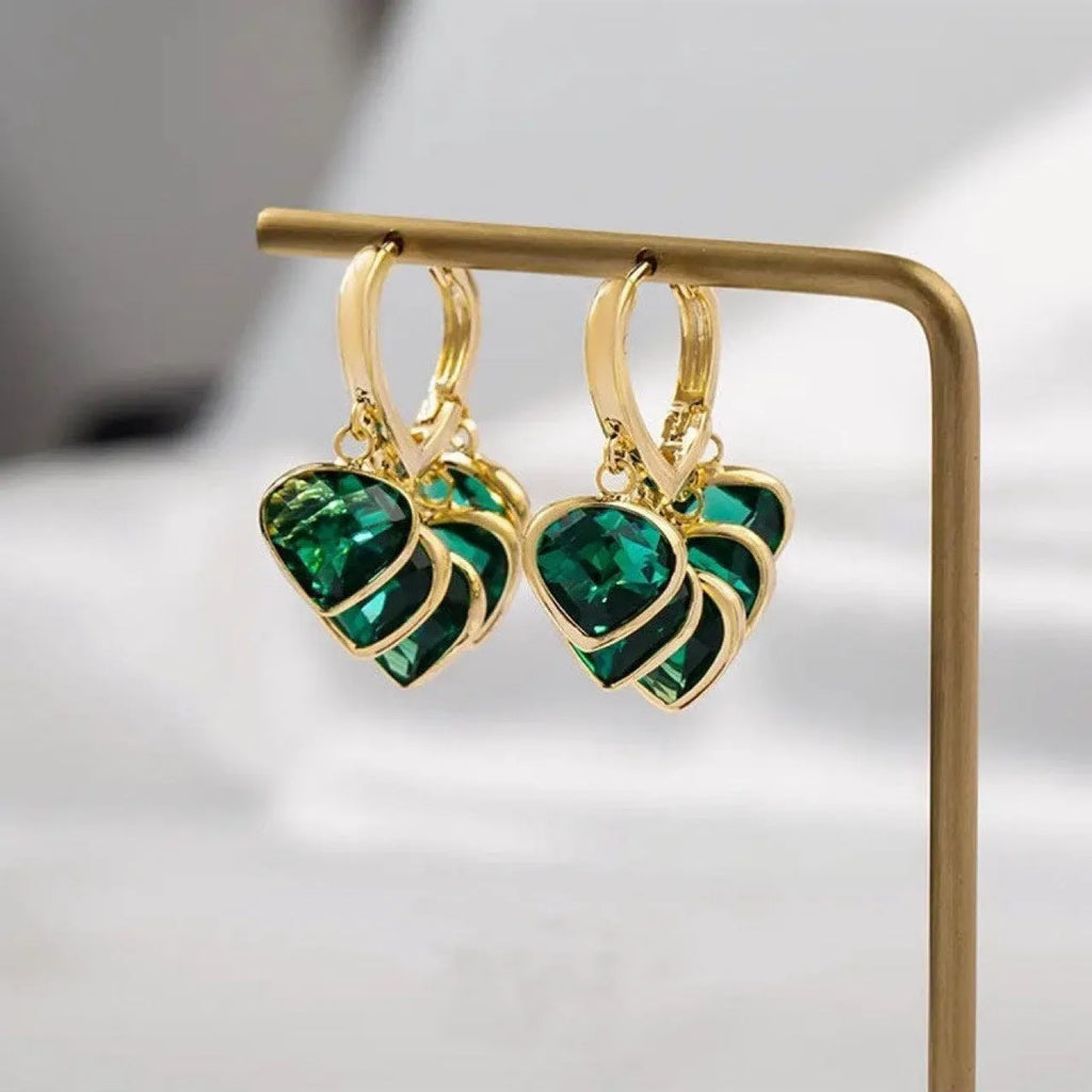 Korean style women's green heart ear clip earrings with alloy inlay gemstone.