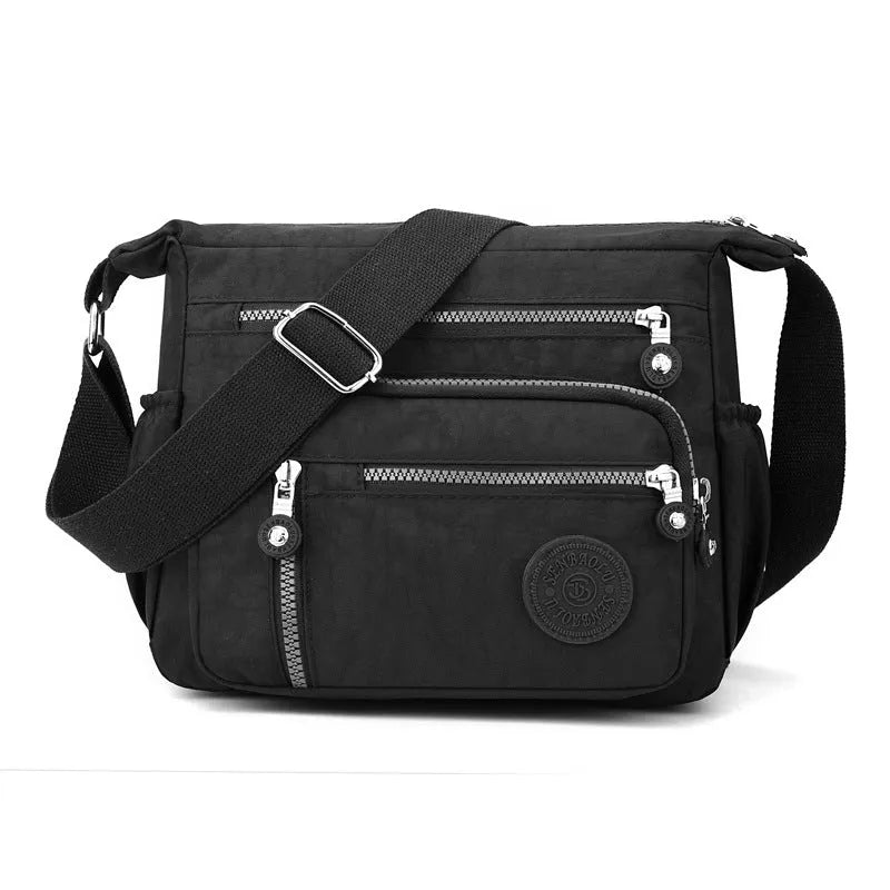 Soft nylon messenger bag with single shoulder strap in square vertical design showing grey colour option