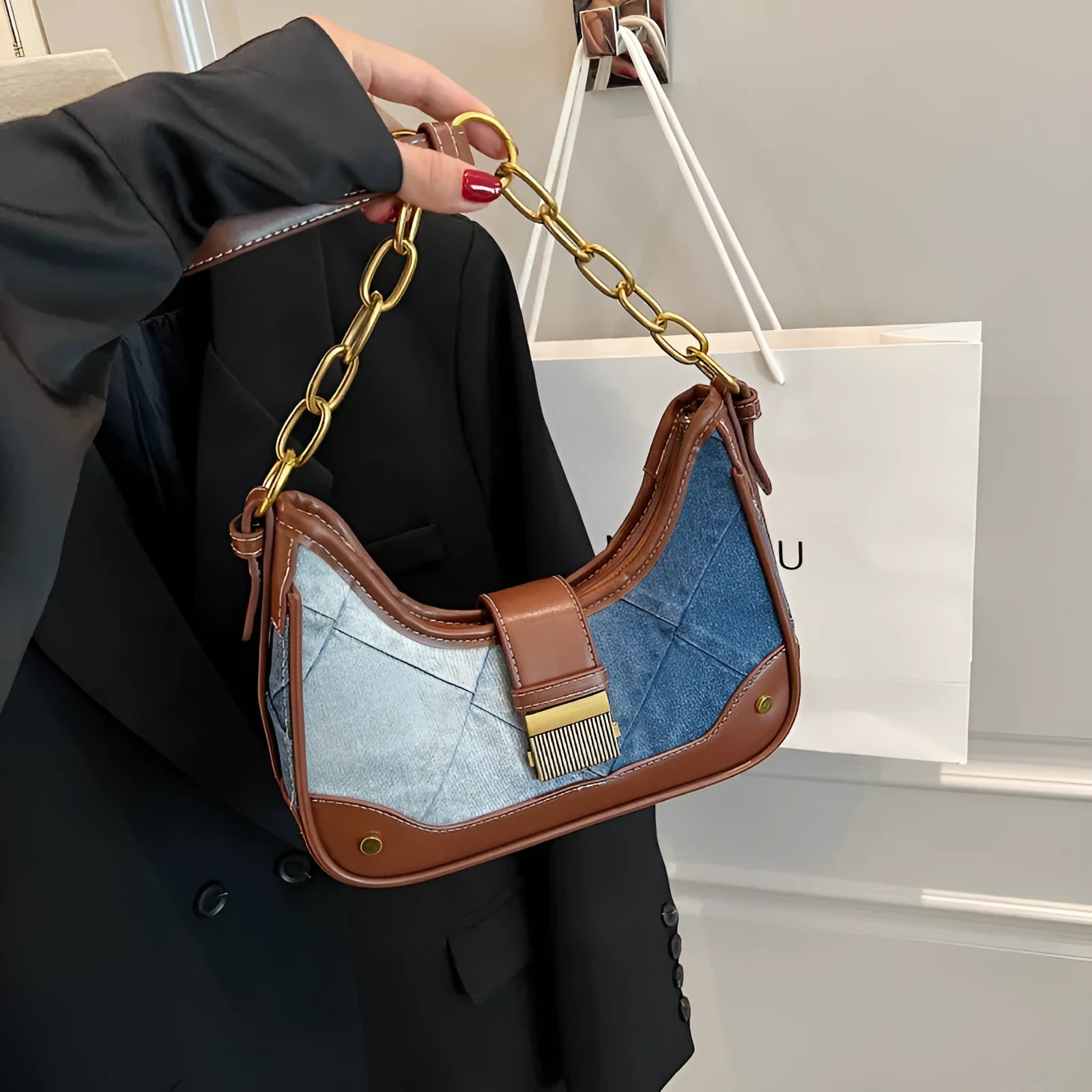 Brown denim women's shoulder bag with chain detailing and bucket shape design