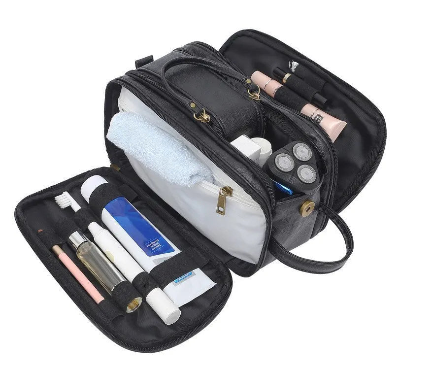 Men's black PU leather toiletry bag with multiple compartments open to show interior organisation