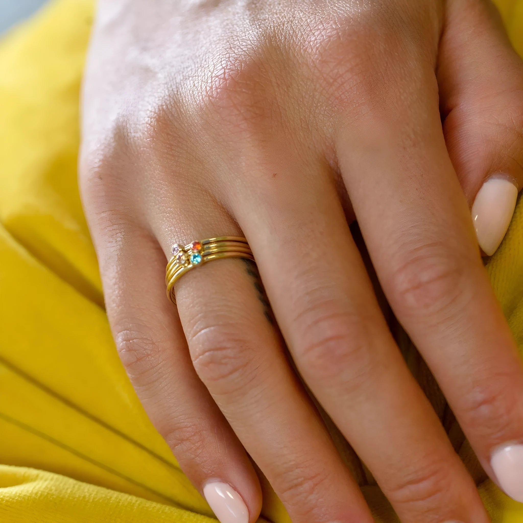 Engraved titanium steel ring with December birthstone design in geometric shape.