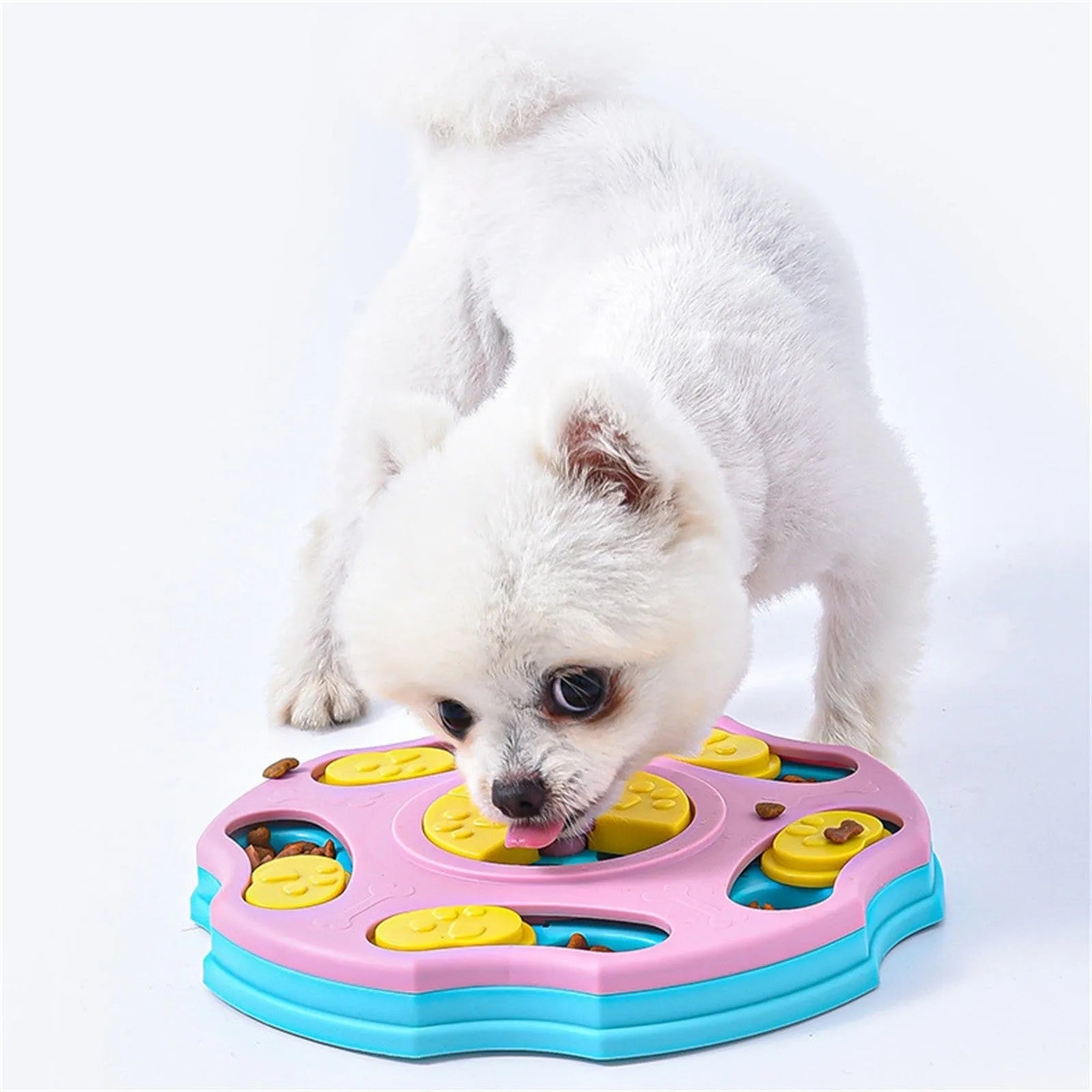 Blue and pink dog puzzle feeder toy with food compartments for interactive play and slow feeding