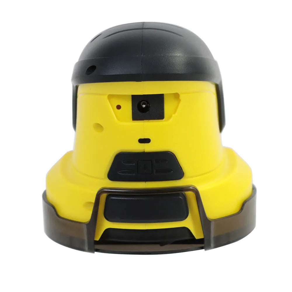 Yellow cordless electric ice scraper with USB charging cable on a car windscreen.