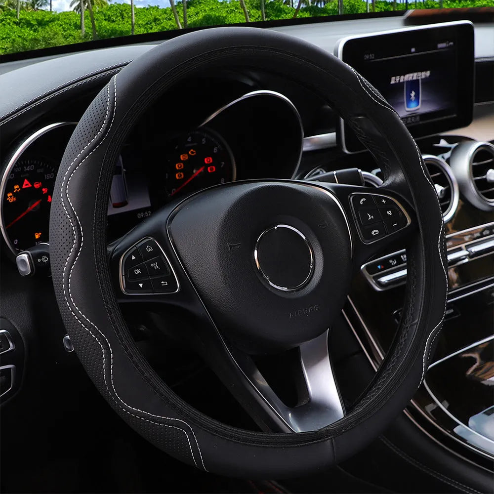 Black elastic steering wheel cover with a corrugated texture, stretched to show its fit.