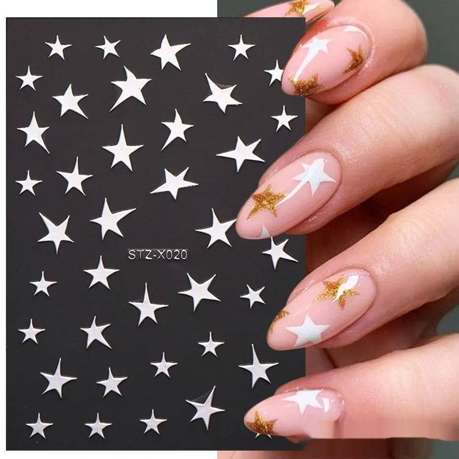 Sheet of black and silver love heart pattern nail art stickers with a plastic nail patch.
