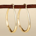 Women's geometric ring design ear clip earrings with drop-shaped elements and electroplated copper construction