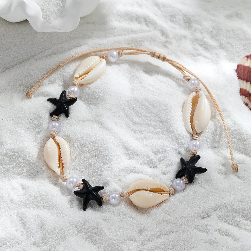 Women's white plastic resin starfish shell pearl anklet on foot with adjustable waterproof wax line