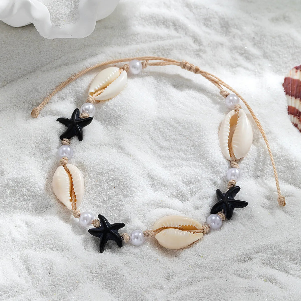 Women's white plastic resin starfish shell pearl anklet on foot with adjustable waterproof wax line