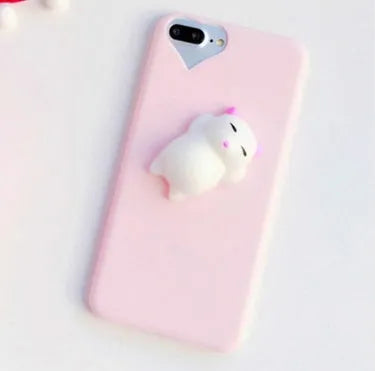Soft pink TPU iPhone case with a raised white 3D cartoon cat design on the back.