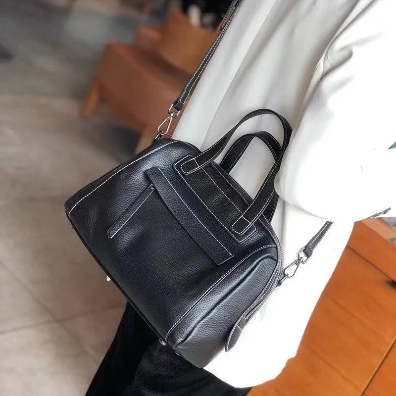 Genuine cowhide leather men's messenger bag in horizontal square shape with lychee pattern.