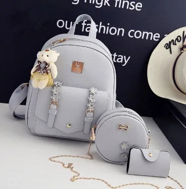 Women's 3-piece leather bag set with floral designs including backpack, shoulder bag and card wallet
