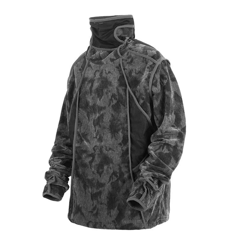 Man wearing a black and grey tie dye printed finger turtleneck sweater with drop shoulder sleeves.