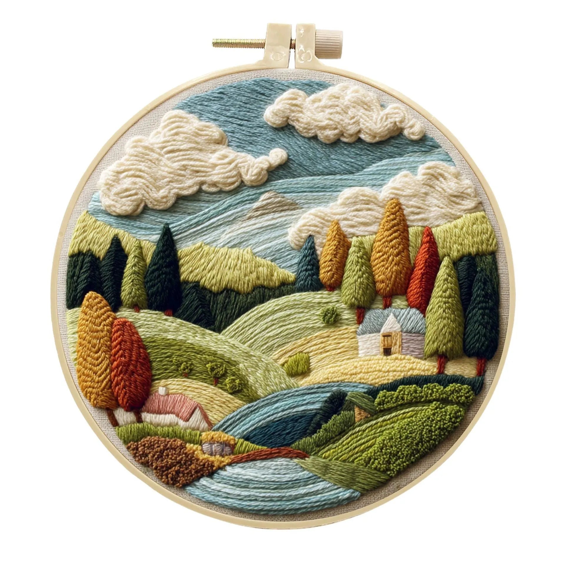 DIY landscape embroidery kit with cotton fabric, bamboo frame, threads and needles arranged for crafting