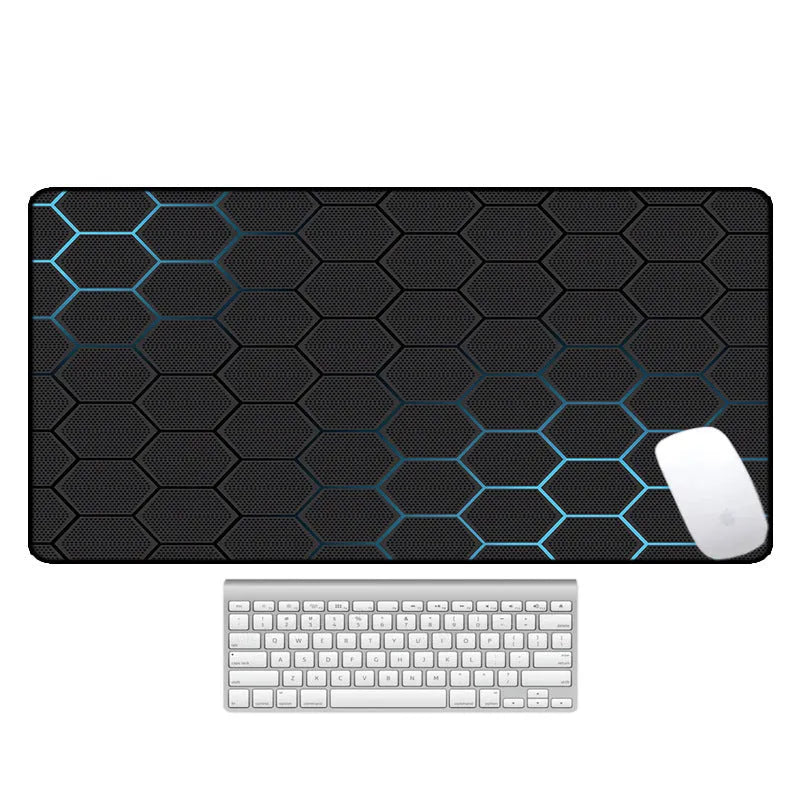 Large natural rubber desk mouse pad with a printed geometric pattern, showing non-slip base.