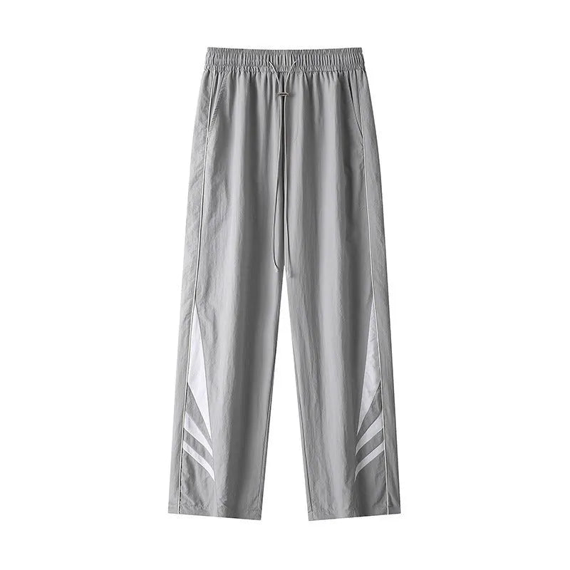 Men's straight-leg sports trousers in black with elastic waistband and button front