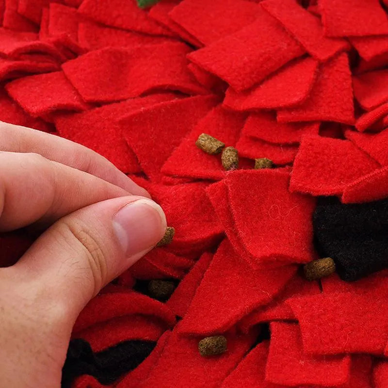 Red and green strawberry-shaped pet slow feeder mat with hiding spots for interactive feeding