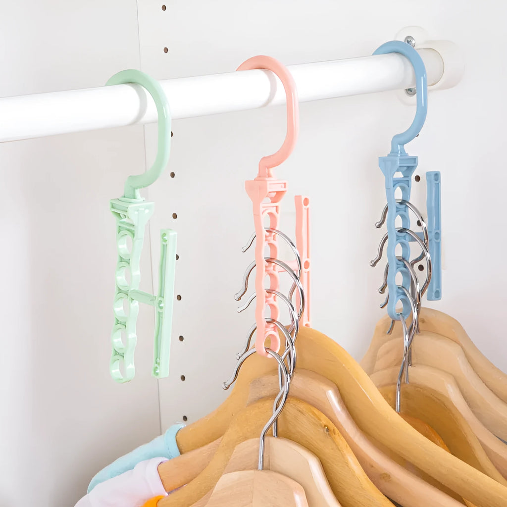 Blue revolving plastic wardrobe hanger with five hanging branches and a central handle for space saving