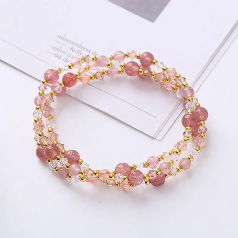 Close-up of a handmade three-stone crystal bracelet with an adjustable cord, shown in a choice of gemstone colours.