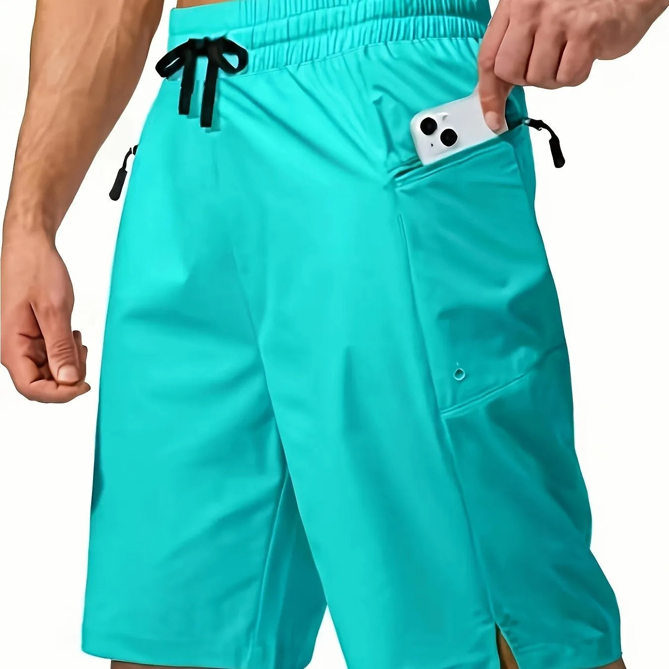 Man wearing solid colour quick-drying polyester beach shorts in a straight leg fit.
